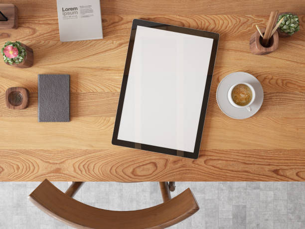 Above View of a Workspace with Empty Digital Tablet Screen stock photo