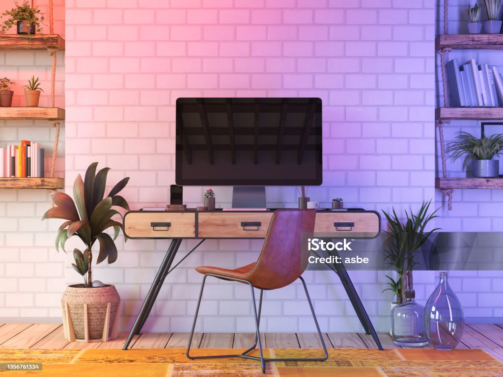 Cozy Workspace with Neon Lights Workspace with Neon Lights. 3D Render Desk Stock Photo