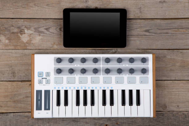 istock Close up of MIDI controller volume fader, knob and keys. 1356761494