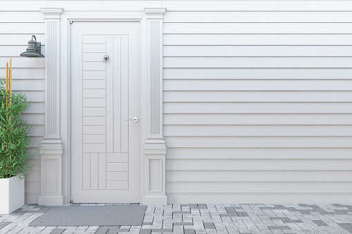 a bathroom or closet closed white door in a new construction house.