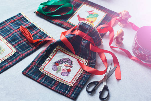 istock Christmas. Beautiful, bright, fabric, handmade gift bag. Gift packaging. 1356761670