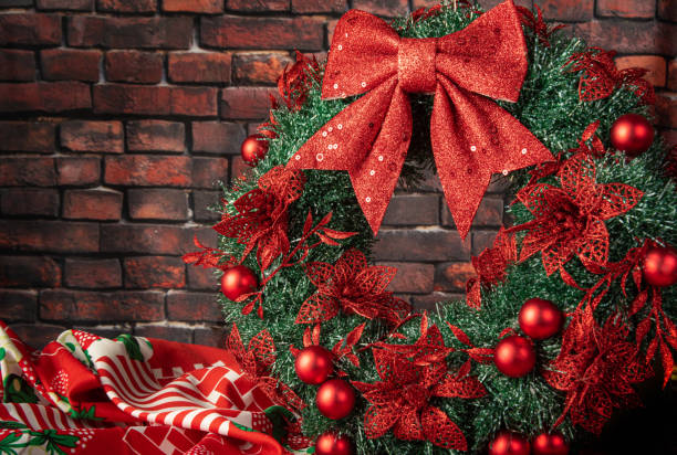 istock Christmas wreath, beautiful Christmas wreath on a table with rustic background, selective focus. 1356761913