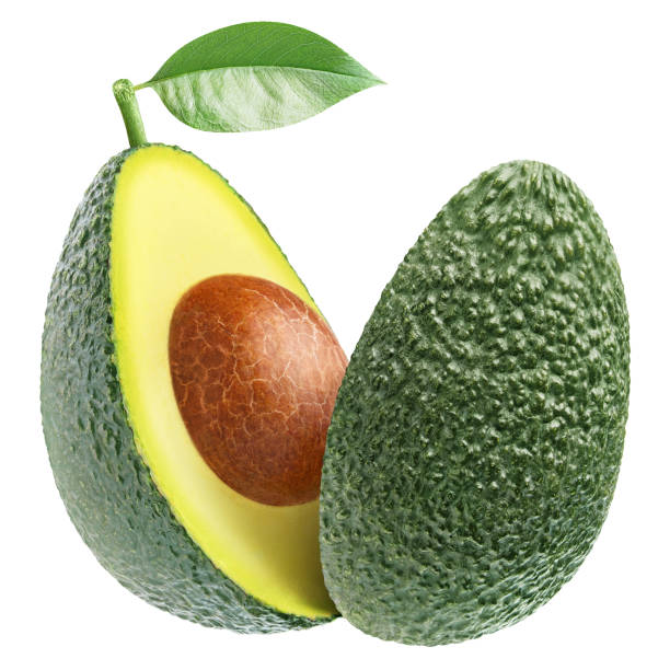 istock Delicious green avocado cut in half on white 1356762751