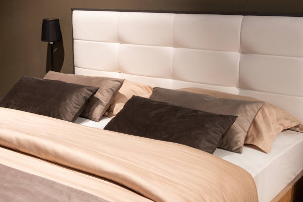 istock Big comfortable bed in hotel room 1356763829