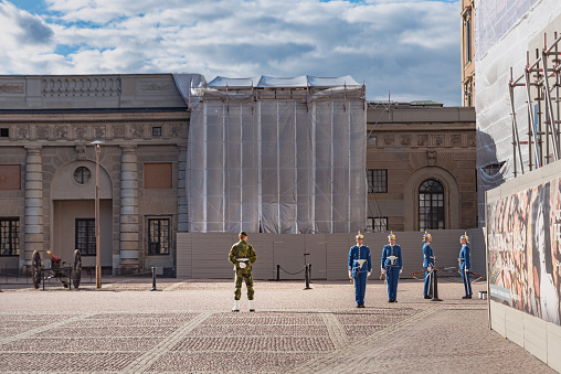 Stockholm, Sweden - 23 07, 2020\n\nGrenadiers of the Royal Swedish Life Guards by the Kungliga slottet. Livgardet changing of guards at The Swedish Royal Palace as a Sergeant checks the leaving troupes