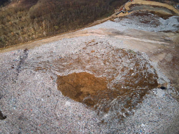istock Aerial drone view of stack of different types of large mountain garbage pile 1356764623