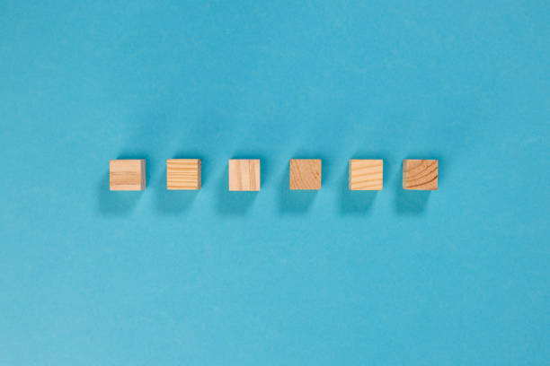 istock 6 wooden cubes lined up without writing to customize on a  blue background 1356764670