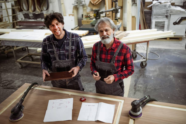 istock Portrait of carpenters at work 1356767383