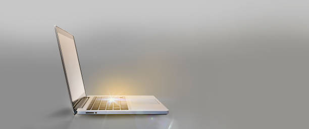 istock Laptop open and placed on a modern looking luxury background. and there was a golden light that shone brightly 1356768419