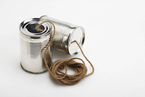 istock Tins cup telephone with rope connecting on white background 1356775271