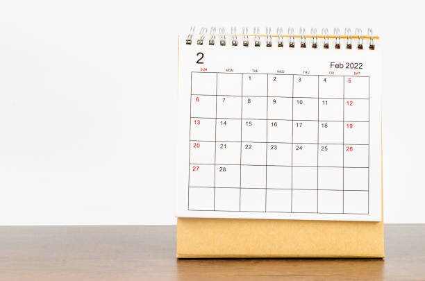 istock February 2022 desk calendar on wooden table. 1356776734