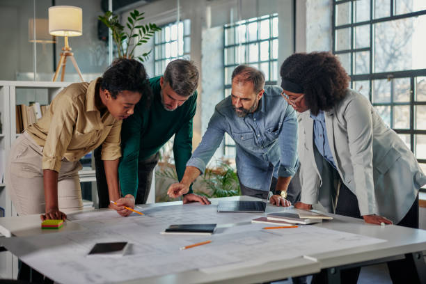 istock Business people working together, brainstorming in office 1356776957