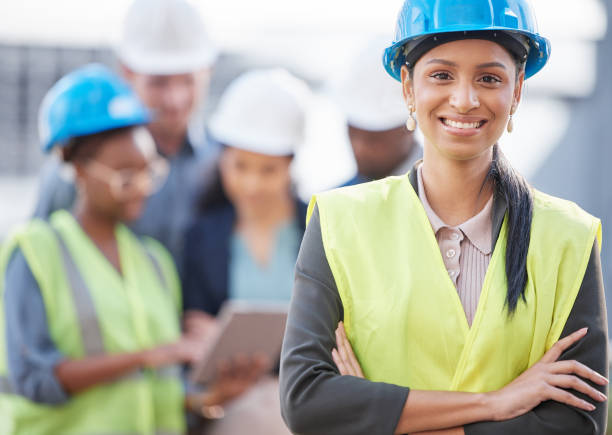 istock Shot of a young woman working at a construction site 1356779114