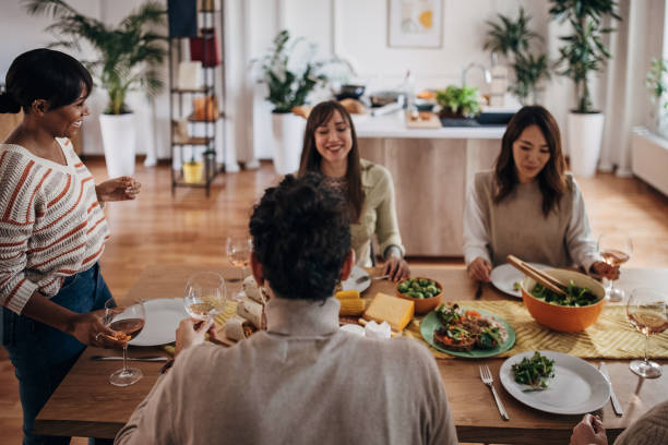 istock Group of people on dinner party 1356781000
