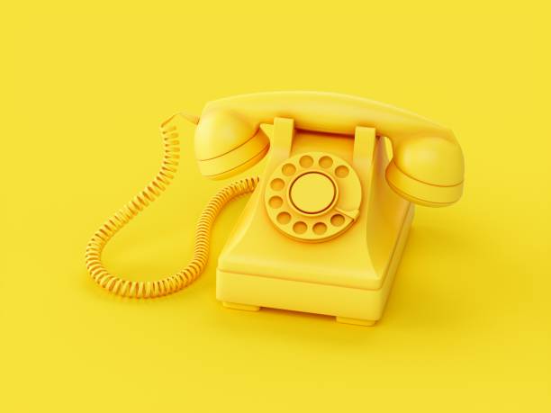 istock 3D rendering Yellow vintage phone isolated on yellow background 1356782858
