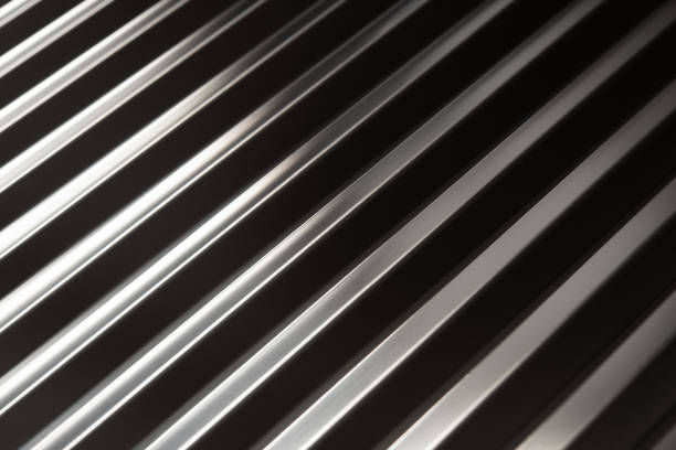 istock Abstract metal design,Reflection of High Definition Silver Metallic and Textured Background 1356785240