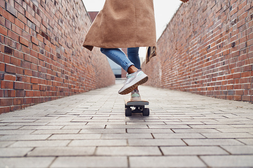 Close-up of woman skating in the city