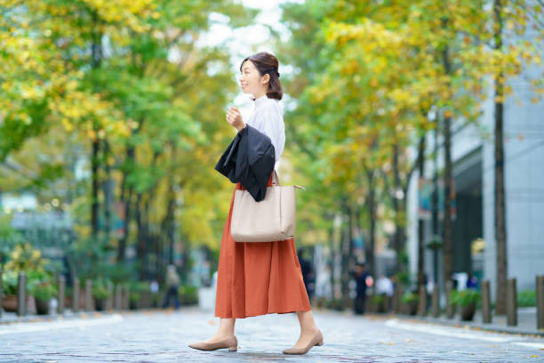 istock Female commuting in office casual style 1356785477