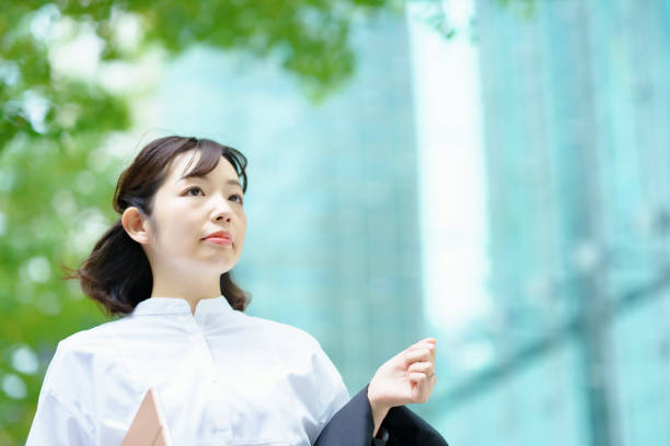 istock Female commuting in office casual style 1356785595