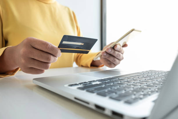 istock Woman using credit card and smartphone register security code payments online shopping and customer service network connection market, using technology on laptop, Internet Online shopping concept 1356785675