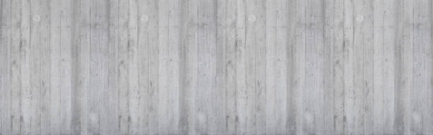 istock Exposed concrete wall not plastered or veneered - concrete wall with wooden structure 1356785762