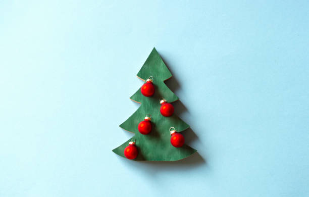 istock Christmas tree and decoration on light blue background. 1356785783
