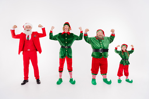 Photo of strong team people demonstrate biceps muscle wear santa elf costume isolated grey color background.