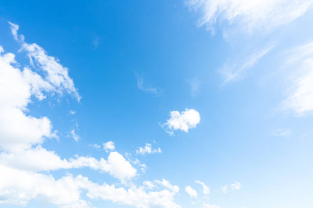 istock Blue sky and white clouds on a sunny day 1356788302