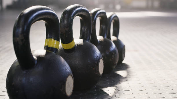 istock Shot of a kettlebells in a row ready to be used 1356791983