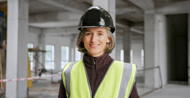 istock Close-up of female architect standing at construction site 1356794991