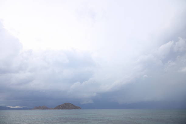 Storm dramatic clouds over the surface of the sea