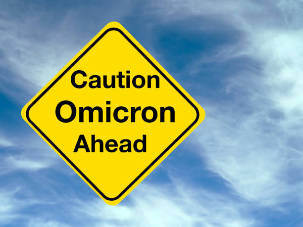 istock Yellow, Caution Omicron Ahead, medical warning sign concept. 1356798666