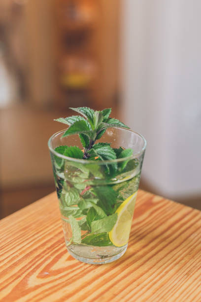 istock View of lemon and mint water on wood table 1356799624