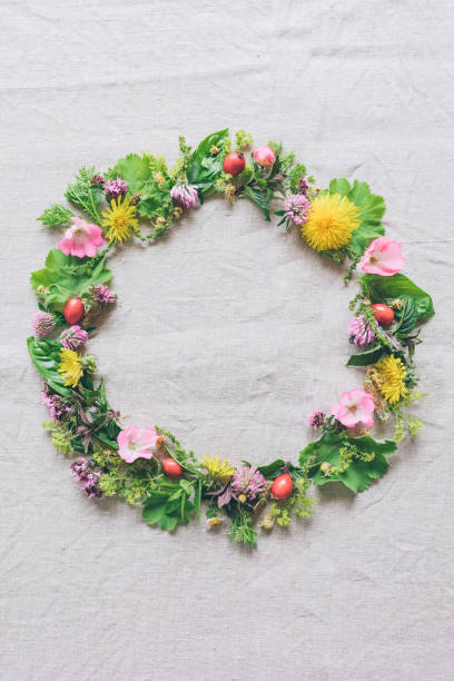 Beautiful flower wreath with colorful blooming flowers isolated on a white background. Midsummer celebration concept, summer decoration.