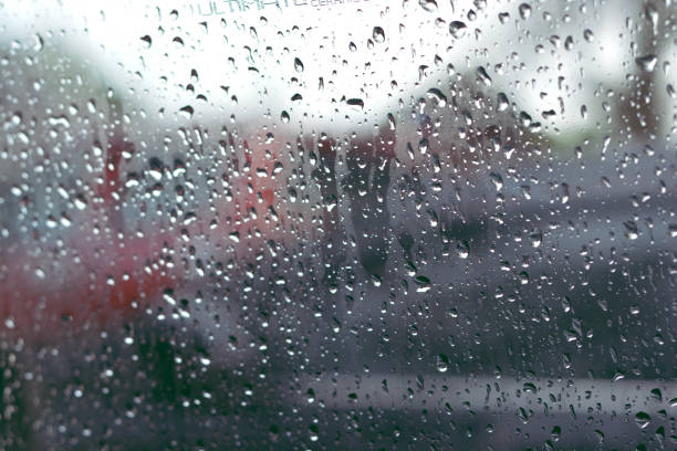 istock Wet mirror with defocused reflections and blurred background. Rain dropped. Selective focus. 1356801624