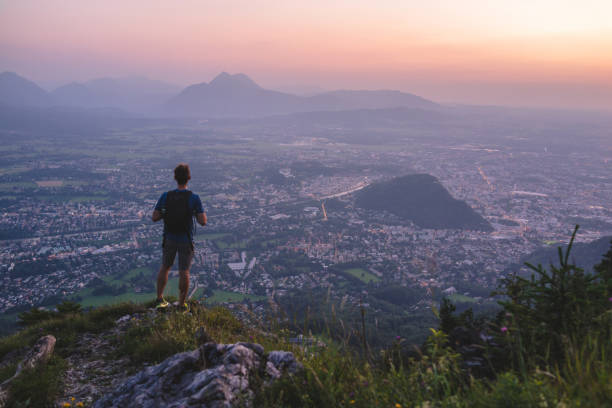 istock Hiker relaxes on mountain ridge at sunrise 1356804282