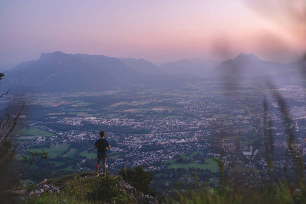 istock Hiker relaxes on mountain ridge at sunrise 1356804305