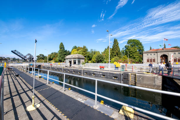 View of the Hiram M. Chittenden Locks, or Ballard Locks Seattle, WA - USA - Sept. 23, 2021: View of the Hiram M. Chittenden Locks, or Ballard Locks, a complex of locks at the west end of Salmon Bay, in Seattle, Washington's Lake Washington Ship Canal ballard-seattle stock pictures, royalty-free photos & images