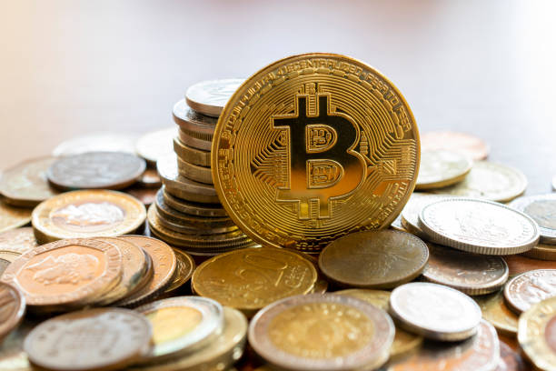 bitcon coin in the middle of multiple coins. cryptocurrency concept São Paulo, Brazil - December 2, 2021: Bitcon currency rising amidst several currencies. Virtual cryptocurrency concept. Bitcoin is a digital asset, used to buy and sell products and services over the internet. santana photos stock pictures, royalty-free photos & images