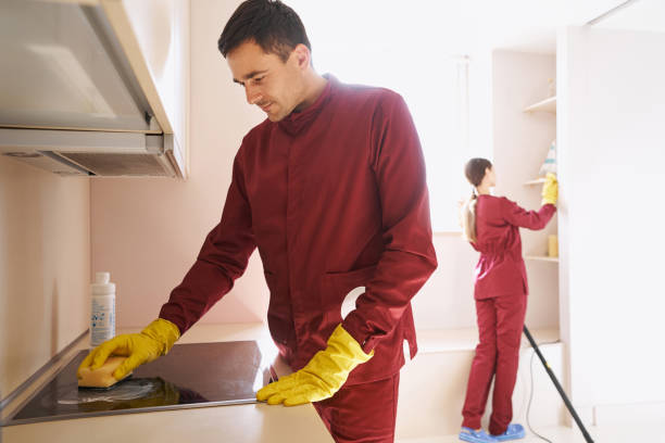 istock Professional cleaners in rubber gloves cleaning kitchen 1356804996