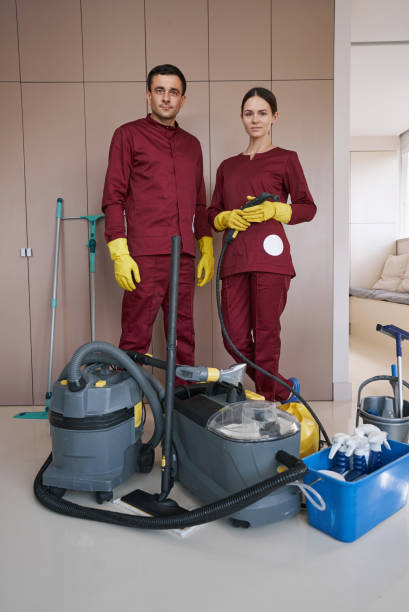 istock Janitorial staff posing for camera in workplace 1356805101