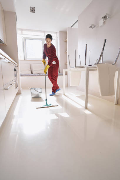 istock Focused experienced Caucasian cleaning lady mopping kitchen 1356805714