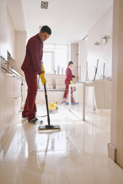 istock Experienced janitorial personnel doing cleaning in kitchen 1356805724