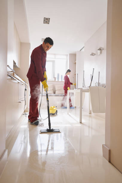 istock Professional janitorial staff doing cleaning in kitchen 1356805728
