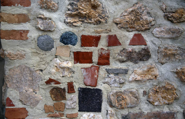 istock Detail of brickwork with colored stones 1356809724