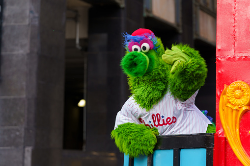 Philadelphia, PA, USA - November 25, 2021: The Phillie Phanatic waves to the crowd at the 102nd annual Thanksgiving Day Parade.