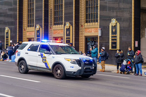 Philadelphia, PA, USA - November 25, 2021: A Philadelphia Police Department marked vehicle with its emergency light activated.