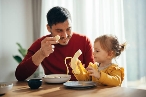 istock Father and Daughter Having a Healthy Breakfast 1356820149