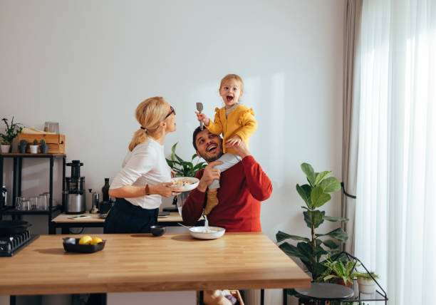 istock Family Playing While Having a Healthy Breakfast in the Kitchen 1356820233