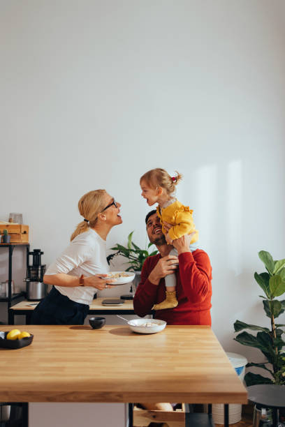 istock Family Playing While Having a Healthy Breakfast in the Kitchen 1356820241